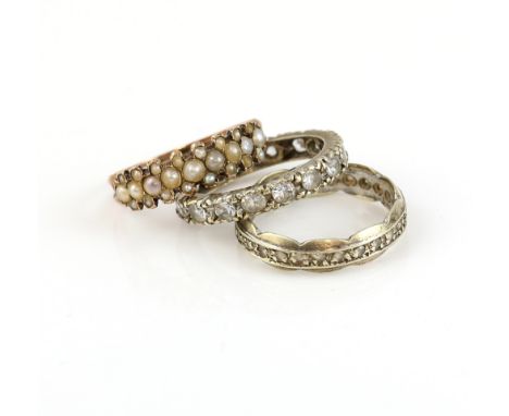 Victorian seed pearl ring, testing as 9 ct, size N, with a scalloped edged white paste ring, in 9 ct white gold, size M and a