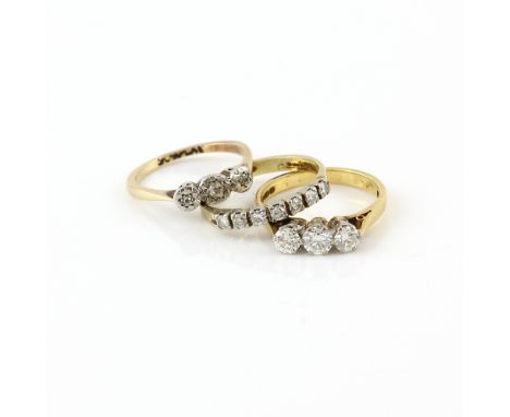 Three diamond rings, three stone ring, set with round brilliant cuts, estimated total weight 0.60 carats, in 18 ct gold, hall