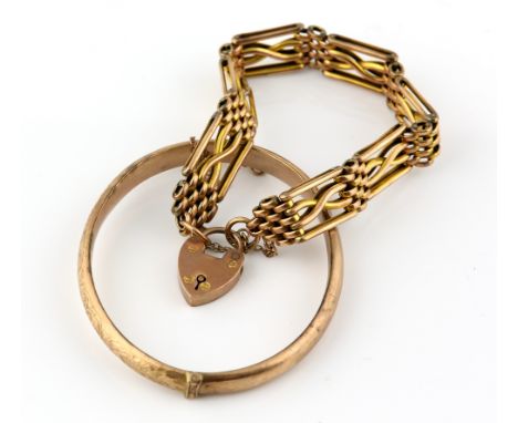 Edwardian oval hinged bangle and fancy link gate bracelet, with padlock heart clasp, measuring approximately 17cm in length, 