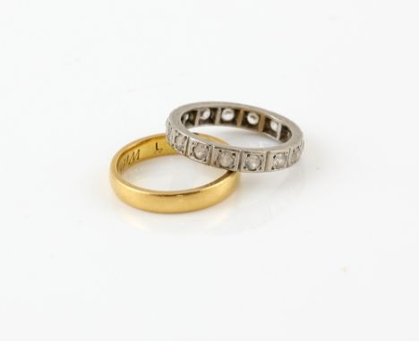 Wedding band, in 22 ct gold hallmarked Birmingham 1936 and paste full eternity ring, in white metal stamped 18 ct, both ring 