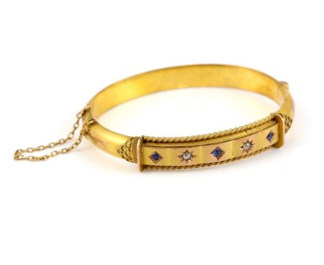 Edwardian bangle, set with old cut diamonds and round cut sapphires, mounted in 9 ct, hallmarked Birmingham 1900, with wirewo