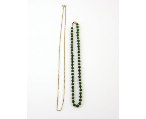 Nephrite jade bead necklace, alternately set with gold beads, to a clasp stamped 18, length 42cm and twist link chain in 18 c