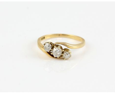 Edwardian diamond twist ring, three old cut diamonds, estimated total weight 0.70 carats, mounted in 18 ct gold, ring size R.