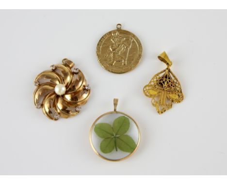 Four pendants, pearl and paste floral twist pendants in yellow metal stamped 18 ct, measuring approximately 3.5 x 3cm , with 