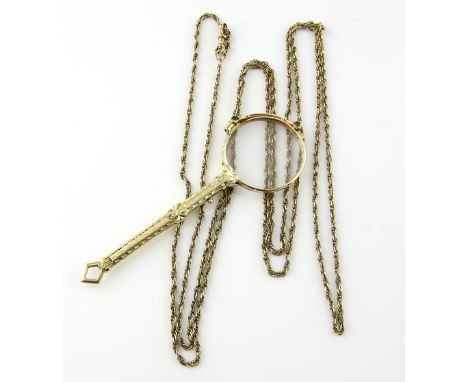 A pair of  Continental antique lorgnettes with an ornate handle, in goldl stamped 14 ct, and  later textured and plain link t