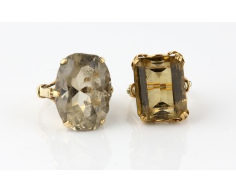 Two quartz rings, emerald cut citrine, estimated weight 24.25 carats, mounted in yellow metal testing as 14 ct, ring size K a