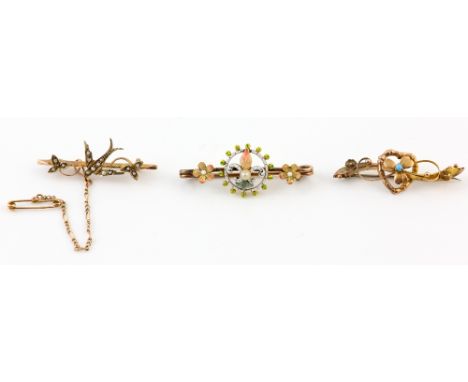 Three antique brooches, one Edwardian enamel, 18 ct  Victorian seed pearl swallow, and heart turquoise bar brooch, both stamp