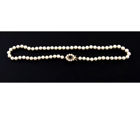 Cultured pearl necklace, white round pearls, measuring 6mm in diameter, strung with knots, pearl and red paste set clasp, mou