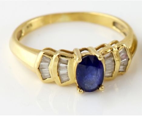  Modern sapphire and diamond dress ring, in yellow metal stamped 18 ct, size K.     CONDITION, good condition, diamonds in ne