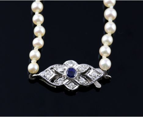 Graduated pearl necklace, with a diamond and sapphire set clasp, white round pearls measuring from 3 to 7mm in diameter, clas