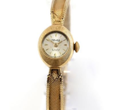  Majex ladies gold watch, the circular silvered signed dial set with gold shaped batons, gold hands ,fitted with a Tissot 217