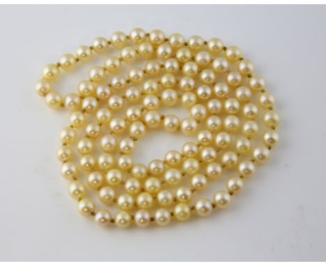Opera length cultured pearl necklace, cream round pearls measuring 6mm in diameter, strung with knots, measuring approximatel