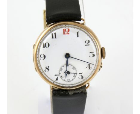 A 1920's gold watch the circular unsigned enamel dial with Arabic numerals, railway minute rack, subsidiary seconds dial  fit