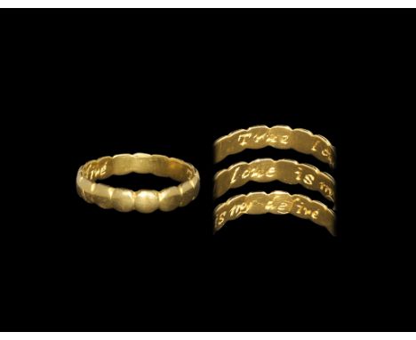 Post Medieval Gold 'True Loue is my desire' Posy Ring 18th century AD. A flat-section hoop with rilled edges, incised inscrip