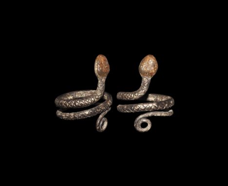 Egyptian Silver Coiled Snake Ring Roman Period, 30 BC-323 AD. A cast D-section coiled band with scale detailing to the outer 