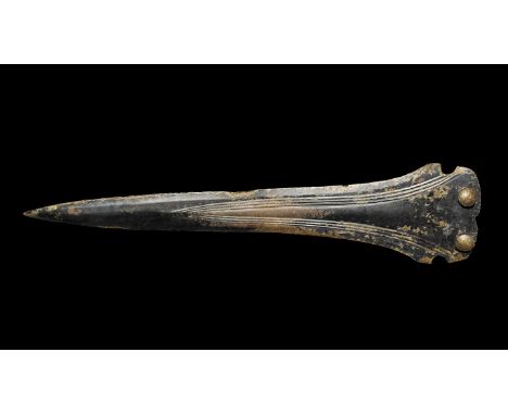 Bronze Age British Group I Dirk 1500-1100 BC. A cast ogival-shaped dirk with three ribs outlined with grooves, rounded butt w