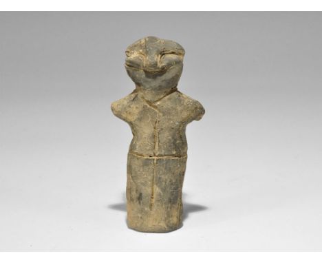 Stone Age Vin?a Ceramic Figure Neolithic, 5000-4000 BC. A terracotta robed figure with stub arms, pinched facial features; in