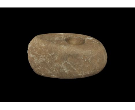 Stone Age Boat-Shaped Pierced Axe Neolithic, 5000-3000 BC. A boat-shaped pecked stone axe-hammer with narrow, slightly convex