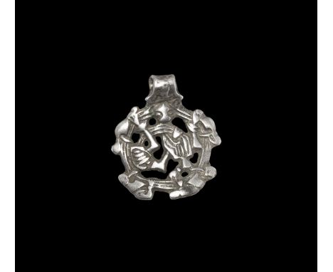 Viking Silver Contorted Beast Pendant 10th-11th century AD. A Smolensk-type concave-section pendant with integral suspension 