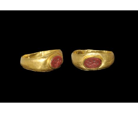 Roman Gold Ring with Eagle Intaglio 2nd-3rd century AD. A shallow D-section hoop with expanding shoulders, elliptical cell wi