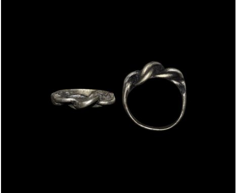 Viking Silver Plaited Finger Ring 9th-11th century AD. A broad flat-section hoop with bezel of three plaited strands. 5.47 gr