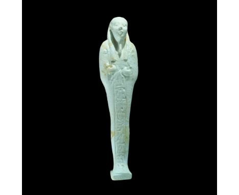 Egyptian Glazed Composition Hieroglyphic Shabti Late Period, 664-332 BC. A finely made pale blue shabti with detailed facial 