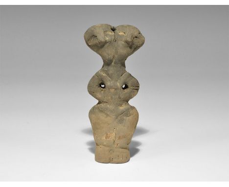 Stone Age Vin?a Ceramic Figure Neolithic, 5000-4000 BC. A terracotta robed figure with C-shaped arms, two heads on a single n