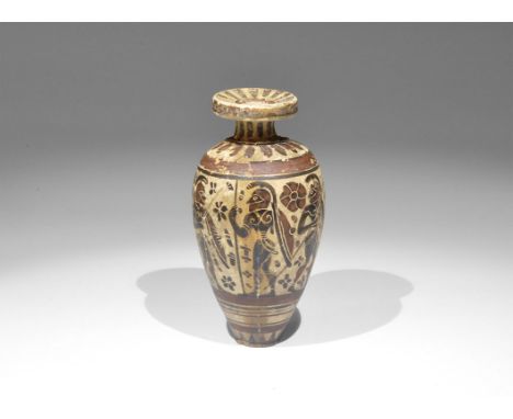 Greek Corinthian Ceramic Aryballos 7th century BC. A piriform aryballos with radiating strokes to the rim and shoulder, conce