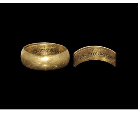 Post Medieval Gold 'I Loue in earnest' Posy Ring 18th century AD. A broad D-section hoop with italic inscription to the inner