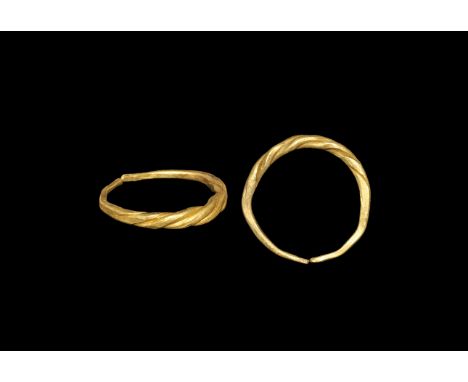 Viking Gold Twisted Wire Ring 9th-11th century AD. A slender penannular hoop formed with expanding rods twisted over each oth