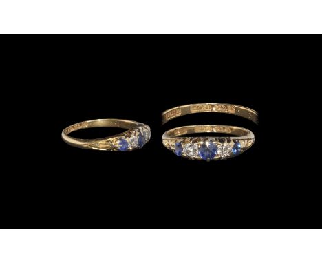 Post Medieval Gold Ring with Sapphires and Diamonds Hallmarked 1916 AD. A D-section hoop with slightly flared shoulders, scro