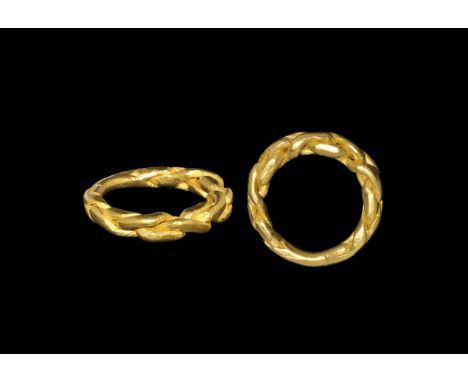 Viking Gold Chain Plait Ring 9th-11th century AD. A round-section hoop comprising three expanding rods plaited into a band, w