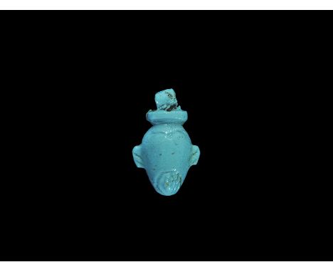 Egyptian Glazed Composition Heart Amulet Late Period, 664-332 BC. A light blue heart amuletic pendant with loop above. 1.30 g