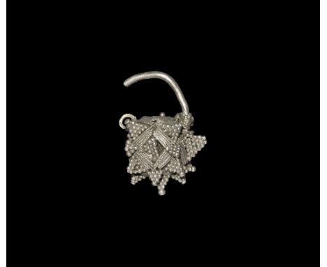 Viking Silver Filigree Earring 7th-10th century AD. A single earring with round-section shank, polyhedral body with multiple 