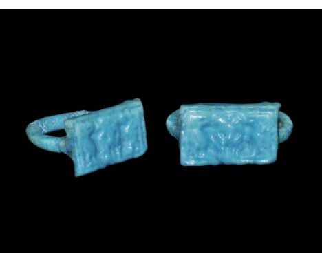 Egyptian Glazed Composition Ring with Cartouche New Kingdom, 1550-1070 BC. A bright blue round-section hoop with rectangular 