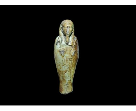 Egyptian Glazed Composition 'Chief of Soldiers' Shabti 29th-30th Dynasty, 399-343 BC. A pale olive green shabti with finely m