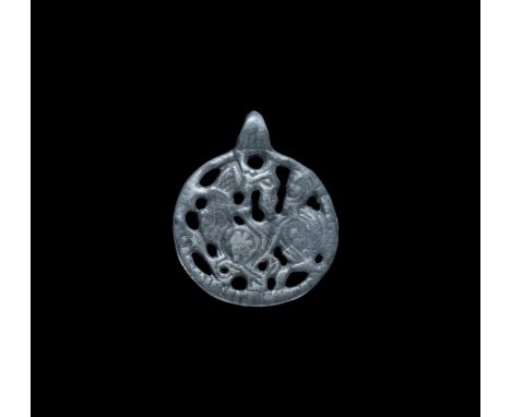 Viking Silver Pendant with Enmeshed Dragon 11th-12th century AD. A flat-section disc pendant with loop above, openwork motif 