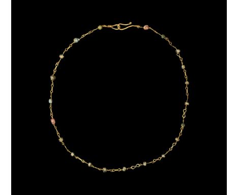 Roman Gold and Glass Bead Necklace 2nd century AD. A necklace of spherical and irregular glass beads on wire stems, linked by