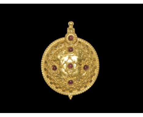 Byzantine Gold Pendant with Garnets 5th-7th century AD. A domed discoid pendant with thick suspension loop, granulated border
