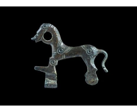 Roman Bronze Decorated Horse Brooch 3rd century AD. A cast plate brooch of a horse modelled in the round with harness and bri