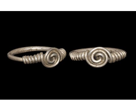 Saxon Silver Twisted-Bezel Ring 6th-9th century AD. A round-section hoop of two wires with twisted spiral bezel and seven coi