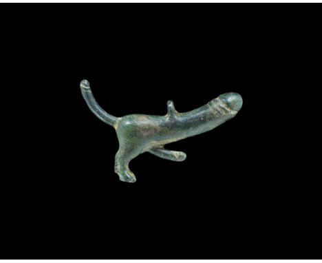 Roman Bronze Phallic Tintinnabulum Pendant 1st century AD. A cast phallic pendant with dog's legs, phallus and tail with phal