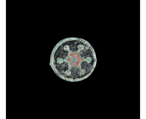 Roman Enamelled Bronze Wheel Brooch 2nd century AD. A flat-section plate brooch with black enamelled face and reserved hub wi