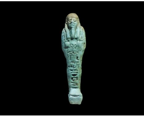 Egyptian Glazed Composition Hieroglyphic Shabti Late Period, 664-332 BC. A pale blue shabti with tripartite wig, false beard,
