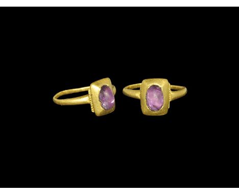 Medieval Gold Ring with Cabochon Amethyst 13th-14th century AD. A narrow D-section hoop with pie-dish bezel granulation to th