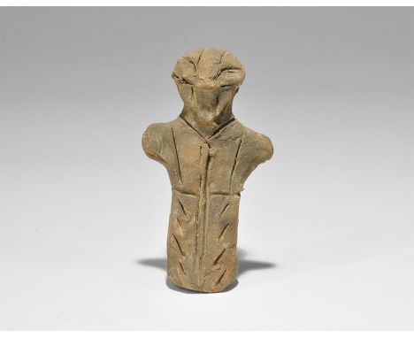 Stone Age Vin?a Ceramic Figure Neolithic, 5000-4000 BC. A terracotta robed figure with stub arms, pinched facial features; in
