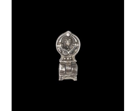Post Medieval Silver Hinged Pendant 16th century AD. A hollow-cast discoid finial with facing female mask (Mary?) within a ci