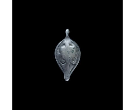Viking Silver Teardrop Pendant 8th-12th century AD. A convex teardrop pendant with integral loop, raised motif of scrolled fo