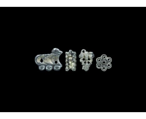 Post-Medieval Tudor Silver-Gilt Belt Mount Group 16th century AD. A mixed group of mounts comprising: a filigree rosette; a p