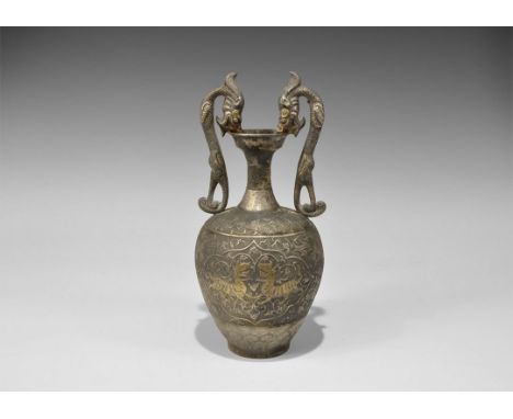 Chinese Silver-Gilt Dragon Vase Tang Dynasty, 618-906 AD. A cast silver vase with bulbous body, narrow neck and flared rim; t